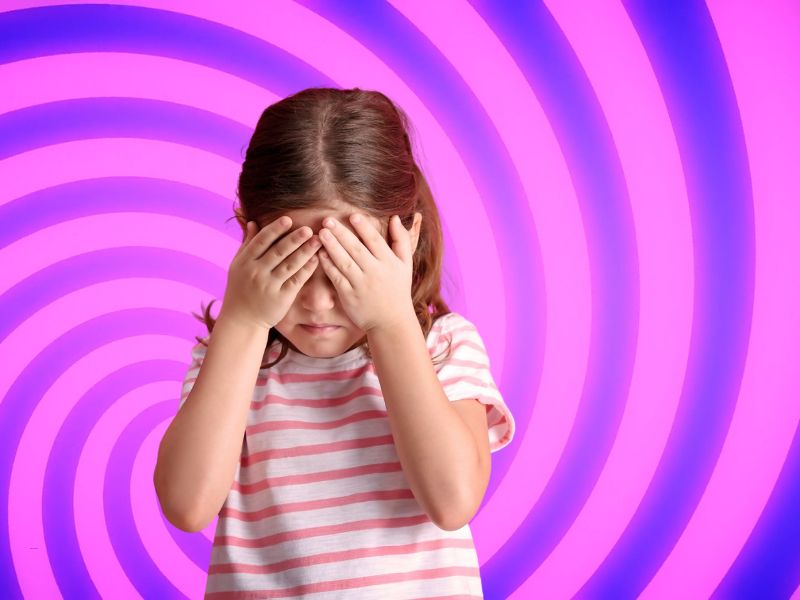 devojčica se drži za glavu u pozadini slika ilustacija vrtoglavice